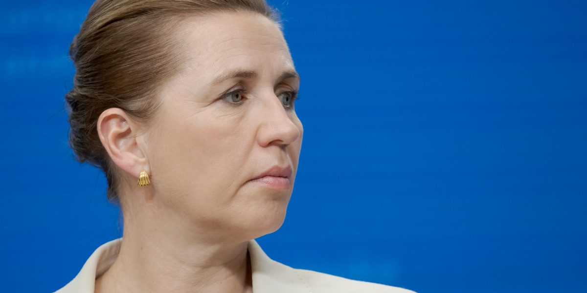Mette Frederiksen speaking at a podium during a diplomatic event