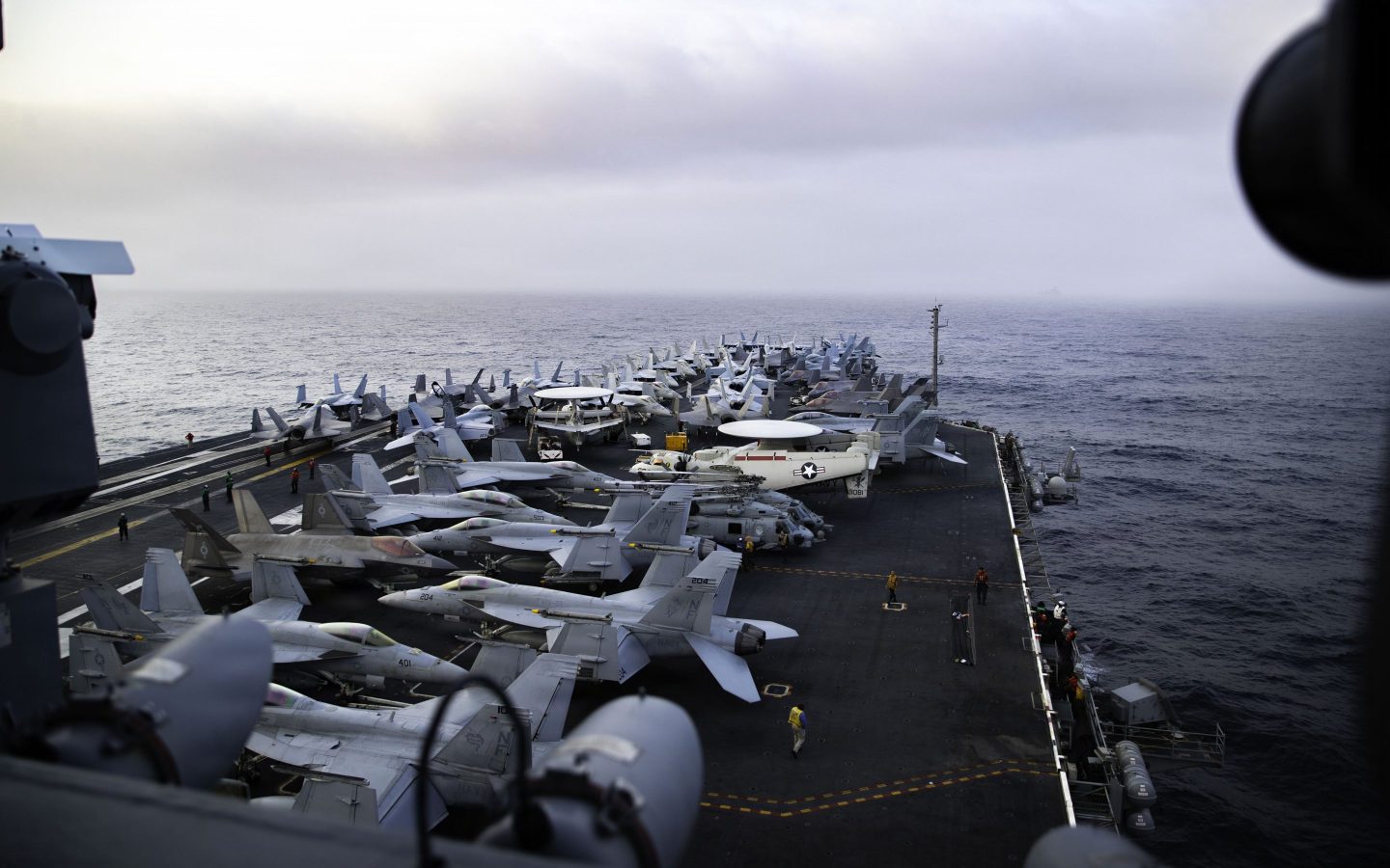 Oil tankers navigating the Strait of Hormuz under US naval escort