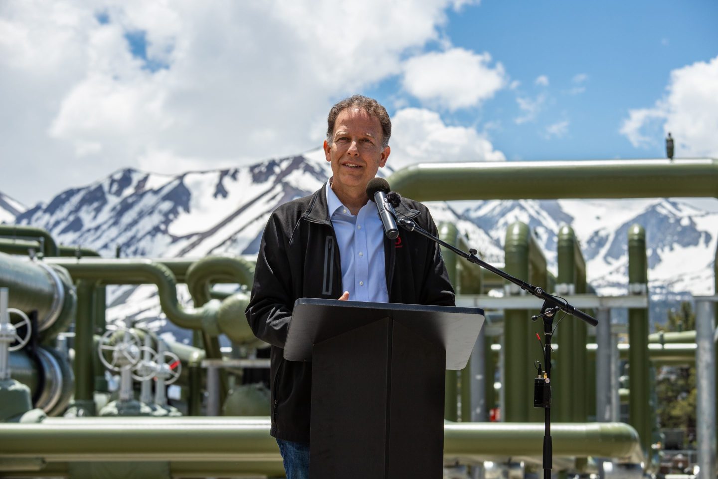 Ormat geothermal plant in Nevada with drilling rigs for enhanced geothermal system pilot