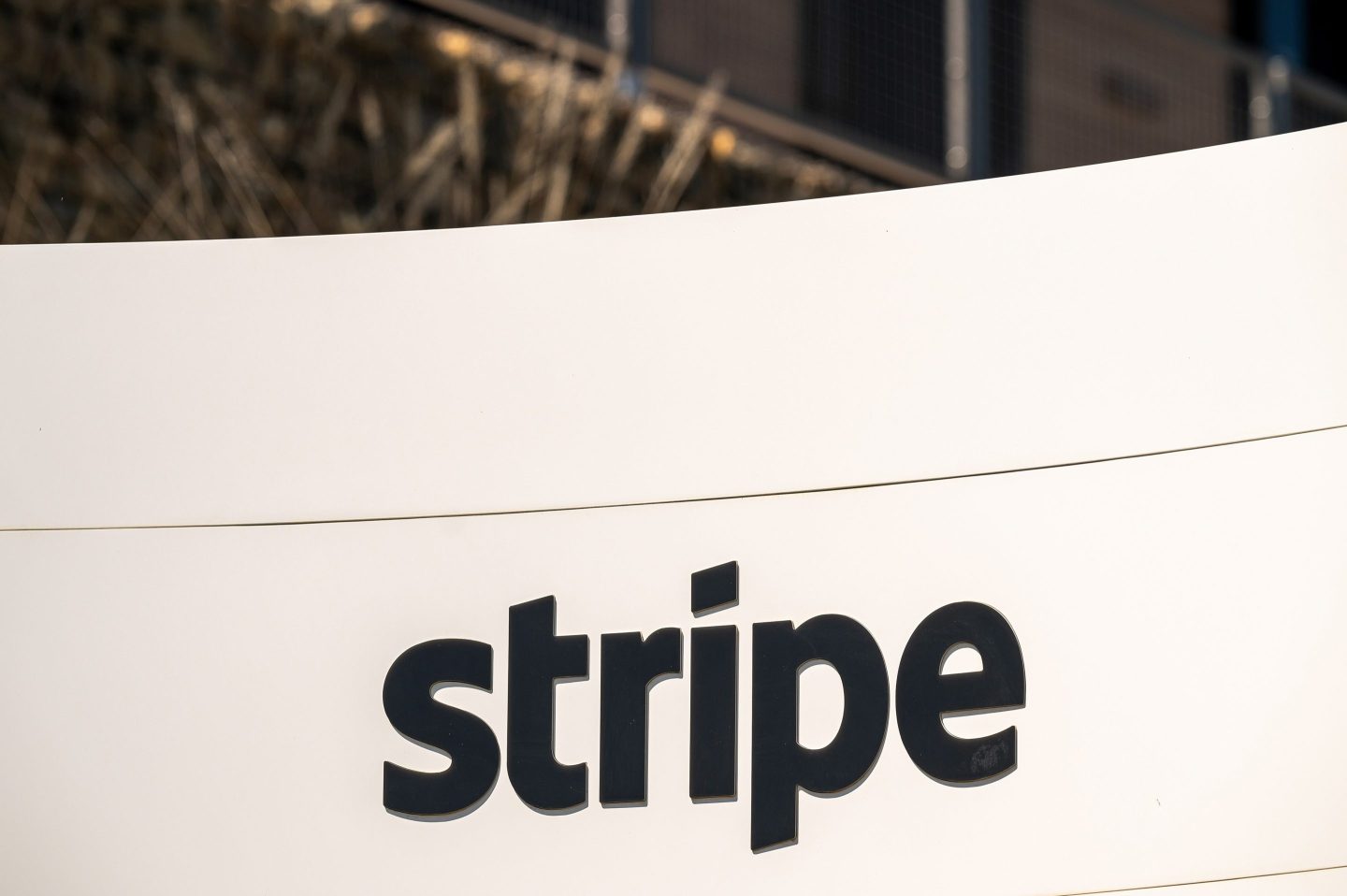 Stripe logo and OpenRouter branding representing acquisition
