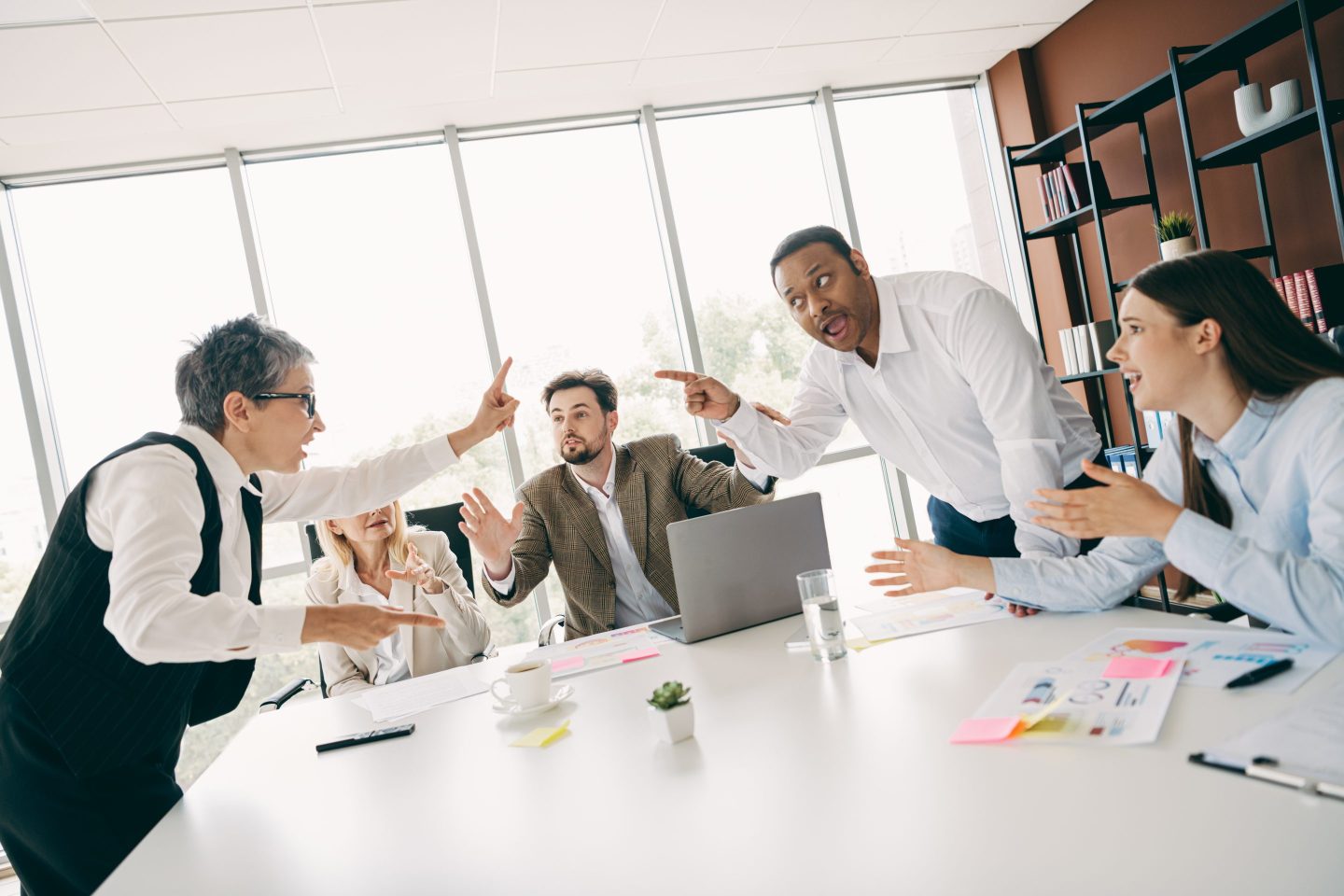 Corporate executives discussing AI strategy around a conference table