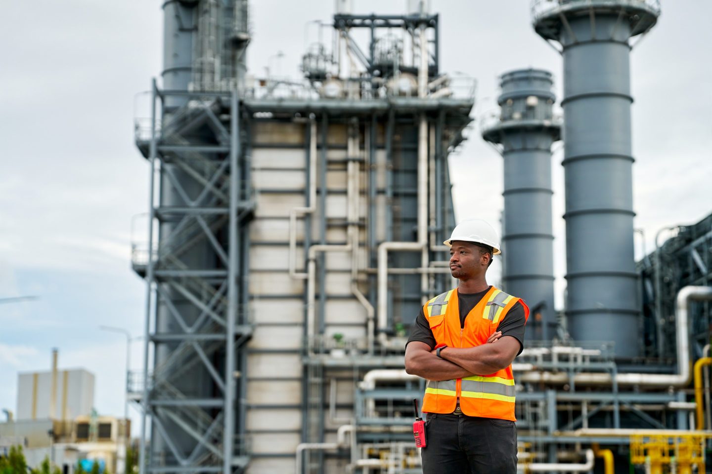 Illustration of workers and robots at a power plant