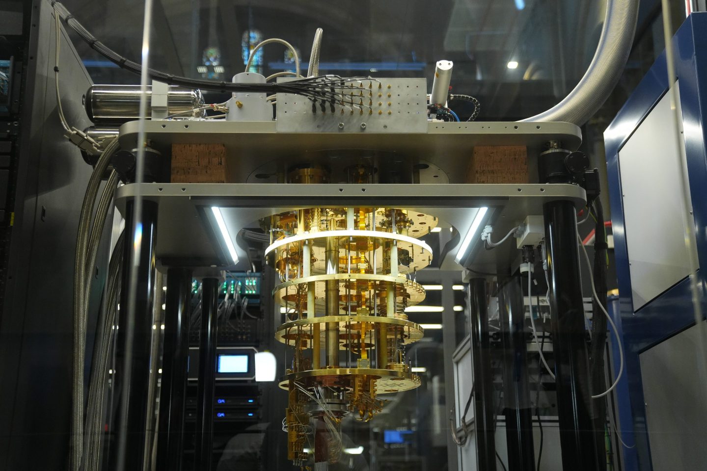 Illustration of a quantum computer hovering over a blockchain network