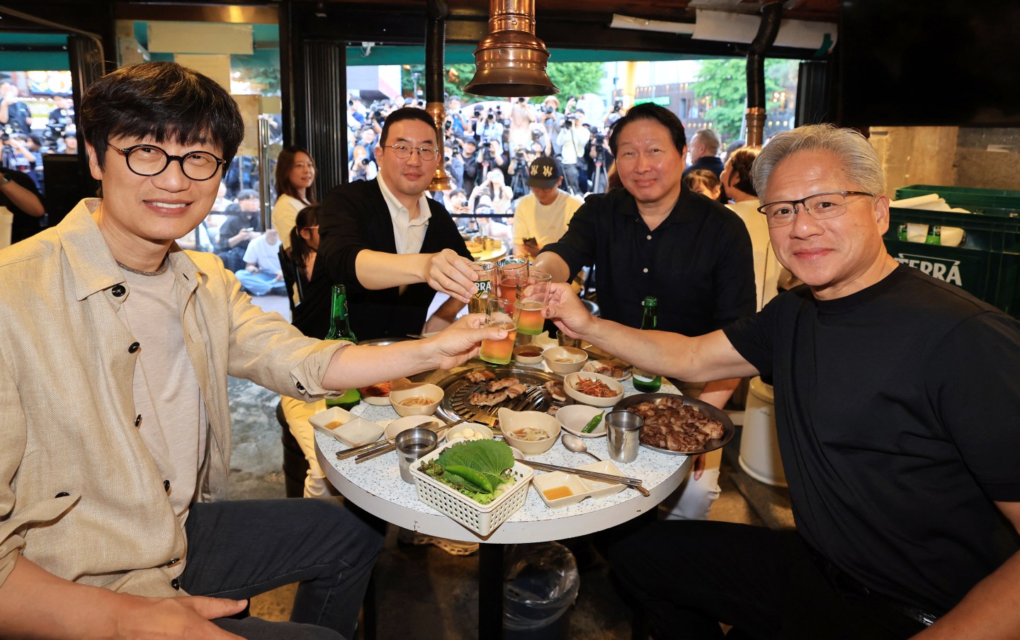 Jensen Huang at a dinner table with business leaders
