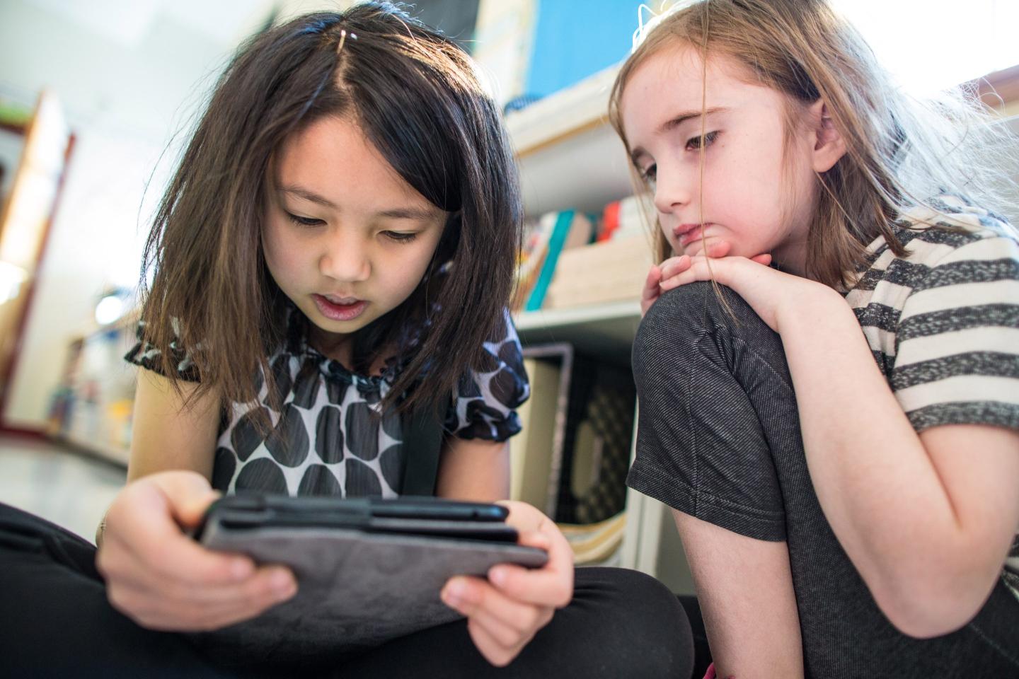 Students using AI tutors at a private school