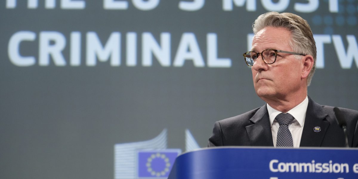 Young people using smartphones while extremist symbols appear on screen